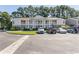 Inviting two-story condo building with balconies and well-maintained landscaping at 3681 Clay Pond Village Ln. # 3103, Myrtle Beach, SC 29579
