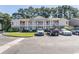 Inviting two-story condo building with balconies and well-maintained landscaping at 3681 Clay Pond Village Ln. # 3103, Myrtle Beach, SC 29579
