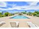 Well-maintained community pool with lounge chairs and surrounding landscaping in a peaceful setting at 3681 Clay Pond Village Ln. # 3103, Myrtle Beach, SC 29579