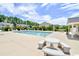 Community pool area featuring a large pool and comfortable lounge seating under a sunny sky at 3681 Clay Pond Village Ln. # 3103, Myrtle Beach, SC 29579