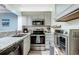 Well-lit kitchen with stainless steel appliances and granite countertops at 415 Ocean Creek Dr. # 2373, Myrtle Beach, SC 29572