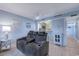 Relaxing living room with a reclining sofa and a view into the adjacent kitchen at 415 Ocean Creek Dr. # 2373, Myrtle Beach, SC 29572
