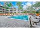 Inviting pool area with ample lounge chairs, providing a relaxing outdoor space for residents and guests at 415 Ocean Creek Dr. # 2373, Myrtle Beach, SC 29572