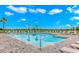 Beautiful pool featuring lounge chairs, blue water and blue skies above at 415 Ocean Creek Dr. # 2373, Myrtle Beach, SC 29572