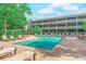 Relaxing pool with lounge chairs, perfect for sunny days and enjoying the beautiful surroundings at 415 Ocean Creek Dr. # 2373, Myrtle Beach, SC 29572