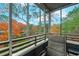 Scenic view from the porch, showcasing lush trees with vibrant fall colors and a glimpse of the pool area at 415 Ocean Creek Dr. # 2373, Myrtle Beach, SC 29572