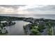 An aerial view features homes surrounding a lake leading to the ocean at 417 S Dunes Dr., Pawleys Island, SC 29585