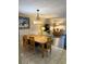 Well-lit dining area featuring wood table with seating for six and views of the living room at 417 S Dunes Dr., Pawleys Island, SC 29585