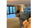Living room with modern decor, comfortable seating and beautiful natural light from the balcony door at 417 S Dunes Dr., Pawleys Island, SC 29585