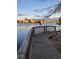 View from wooden deck, featuring a heron, pond, and houses in the distance at 417 S Dunes Dr., Pawleys Island, SC 29585