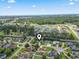 Wide aerial view of a neighborhood with a home pinpointed in a lush area with a coastal skyline at 4197 Friendfield Trace, Little River, SC 29566