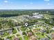 Spacious aerial view of a neighborhood with a pinpointed home near schools and a coastal skyline at 4197 Friendfield Trace, Little River, SC 29566