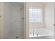 Bathroom with a separate shower and tub at 4197 Friendfield Trace, Little River, SC 29566