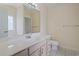 Bathroom featuring a large mirror, vanity with drawers, and tiled floor at 4197 Friendfield Trace, Little River, SC 29566