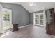 Bedroom featuring wood-look floors, windows, and ample lighting at 4197 Friendfield Trace, Little River, SC 29566