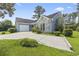 Inviting single-story home boasting a two-car garage, neat landscaping, and a long driveway for ample parking at 4197 Friendfield Trace, Little River, SC 29566
