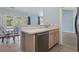 The kitchen area is adjacent to the dining area with wood look floors, ample counter space and stainless steel dishwasher at 4197 Friendfield Trace, Little River, SC 29566