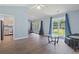 Open concept living room featuring vaulted ceilings, wood floors, lots of natural light and access to kitchen at 4197 Friendfield Trace, Little River, SC 29566