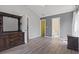 Spacious main bedroom with wood-look floors, ensuite bath, and large closet at 4197 Friendfield Trace, Little River, SC 29566