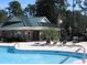 Resort-style pool area with comfortable lounge chairs for relaxing and enjoying the sunny weather at 4570 Fringetree Dr., Murrells Inlet, SC 29576