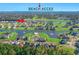 Aerial view of the neighborhood with beach access, waterway, and green golf courses in a park-like setting at 496 West Palm Dr., Myrtle Beach, SC 29579
