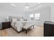 Bright bedroom featuring luxury vinyl plank flooring, a tufted headboard, and lots of natural light at 496 West Palm Dr., Myrtle Beach, SC 29579