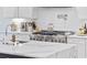 Close-up of a gourmet kitchen showcasing a stainless steel range, custom cabinetry, and elegant marble countertops, ready for cooking at 496 West Palm Dr., Myrtle Beach, SC 29579