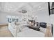 Spacious living room featuring a modern ceiling fan and comfortable white sofa at 496 West Palm Dr., Myrtle Beach, SC 29579