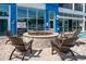 Outdoor fire pit surrounded by chairs and the pool, perfect for relaxation and entertainment at 504 N Ocean Blvd. # 1901, Myrtle Beach, SC 29577