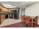Well-equipped kitchen adjacent to the dining area featuring black appliances and wood cabinetry at 504 N Ocean Blvd. # 1901, Myrtle Beach, SC 29577