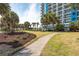 Beautiful walkway lined with palm trees and manicured landscaping leading up to the resort at 504 N Ocean Blvd. # 1901, Myrtle Beach, SC 29577