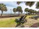 Relaxing lounge area with comfortable seating, lush landscaping, and the ocean in the background at 504 N Ocean Blvd. # 1901, Myrtle Beach, SC 29577