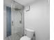 Bathroom featuring a glass shower with stylish tile and a modern toilet at 5511 N Ocean Blvd. # 1603, Myrtle Beach, SC 29577