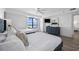 Bright bedroom with two beds, blue dresser, and ocean views from the window at 5511 N Ocean Blvd. # 1603, Myrtle Beach, SC 29577