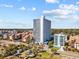 A high-rise condominium building with ocean views and a manicured landscape on a bright, sunny day at 5511 N Ocean Blvd. # 1603, Myrtle Beach, SC 29577