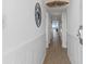 Hallway features wood floors and white wainscoting with Surf Shack sign near the ocean at 5511 N Ocean Blvd. # 1603, Myrtle Beach, SC 29577