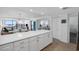 Open-concept kitchen with an island and ocean views flowing to the dining and living areas at 5511 N Ocean Blvd. # 1603, Myrtle Beach, SC 29577