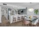 Open-concept kitchen featuring bar seating and views of the dining area at 5511 N Ocean Blvd. # 1603, Myrtle Beach, SC 29577