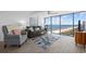 Inviting living room with floor-to-ceiling windows showcasing stunning ocean views at 5511 N Ocean Blvd. # 1603, Myrtle Beach, SC 29577