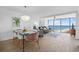 Cozy living room with ocean view, stylish furniture, and a chandelier at 5511 N Ocean Blvd. # 1603, Myrtle Beach, SC 29577