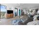 Open-concept living room with ocean view, modern furniture, and hardwood floors at 5511 N Ocean Blvd. # 1603, Myrtle Beach, SC 29577