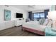 Relaxing main bedroom with view of the ocean, luxury vinyl floors and white dresser at 5511 N Ocean Blvd. # 1603, Myrtle Beach, SC 29577