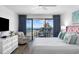 Comfortable main bedroom with a balcony view of the ocean, luxury vinyl floors and white dresser at 5511 N Ocean Blvd. # 1603, Myrtle Beach, SC 29577