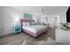 Comfortable main bedroom with a ceiling fan, luxury vinyl floors, and bright natural light at 5511 N Ocean Blvd. # 1603, Myrtle Beach, SC 29577
