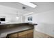 Kitchen countertop features under-cabinet lighting, wood cabinets, granite countertops and access to living area at 5511 N Ocean Blvd. # 310, Myrtle Beach, SC 29577
