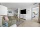 Inviting living room with comfortable seating, TV, and open access to the bedroom at 5511 N Ocean Blvd. # 310, Myrtle Beach, SC 29577