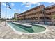 Unique swimming pool surrounded by brick pavers and palm trees in front of the condo building at 5511 N Ocean Blvd. # 310, Myrtle Beach, SC 29577