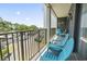 A private balcony features blue Adirondack chairs and overlooks a parking lot at 5905 South Kings Hwy. # A337, Myrtle Beach, SC 29575