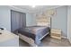Serene bedroom featuring coastal decor, soft gray bedding, and wood-look flooring at 5905 South Kings Hwy. # A337, Myrtle Beach, SC 29575