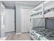 Bedroom featuring bunk beds, closet, and blue walls at 5905 South Kings Hwy. # A337, Myrtle Beach, SC 29575